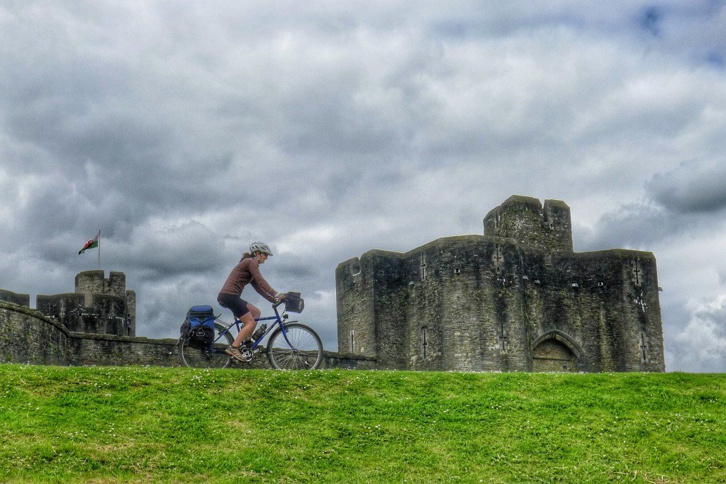 Carrie rides along the levee of the outer moat of the Caerphilly Castle.