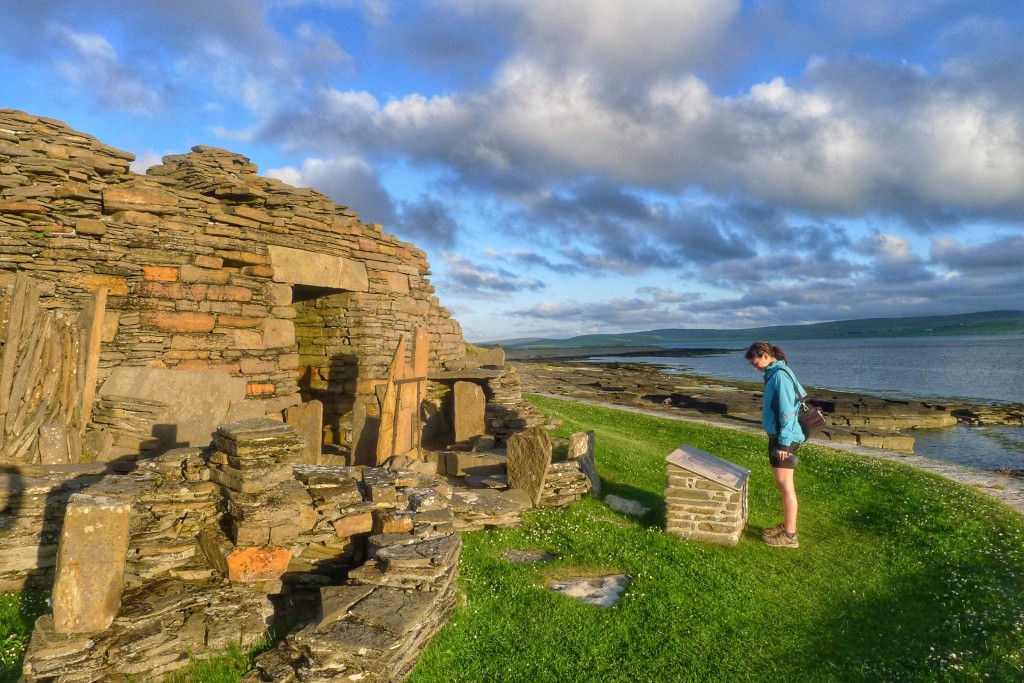 Carrie reads up on the Midhowe Broch. Brochs are circular buildings built about three thousand years ago. Experts cannot agree on what the brochs were used for. Regardless, they're fun to walk around to admire ancient architecture.