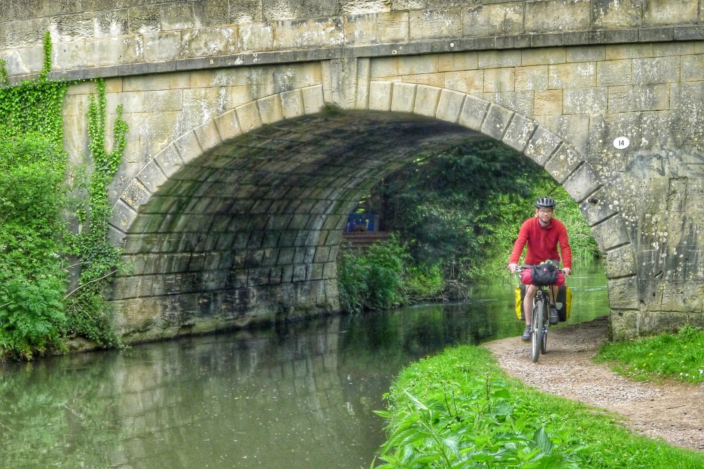 Passing under a bridge on some sweet tow path single track.