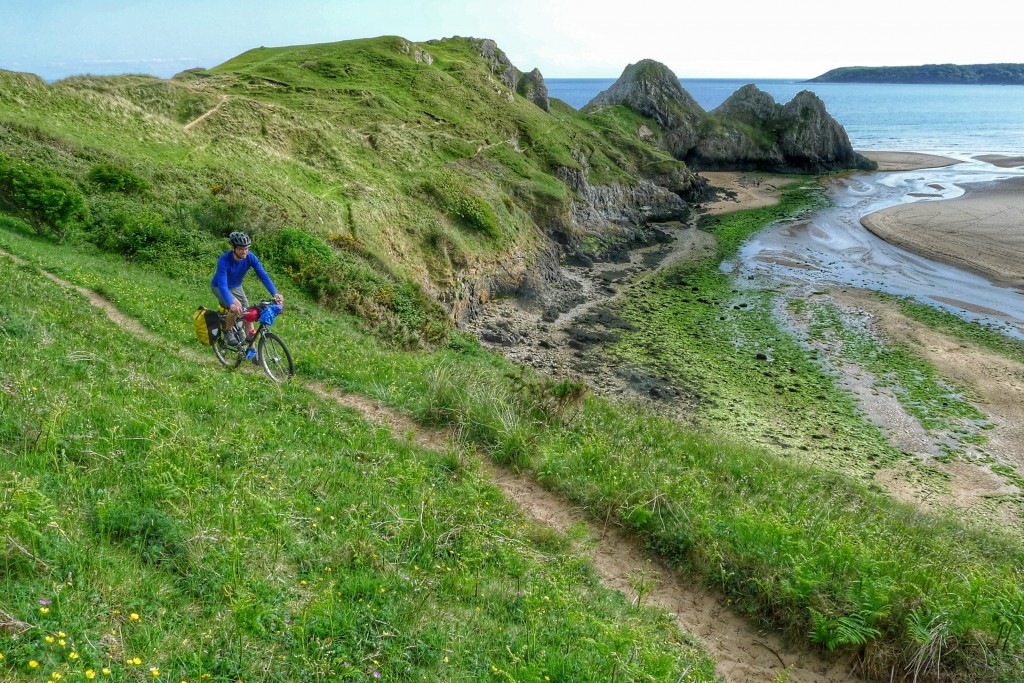 I tried to ride small portions of the sand dunes above Three Cliffs Bay.