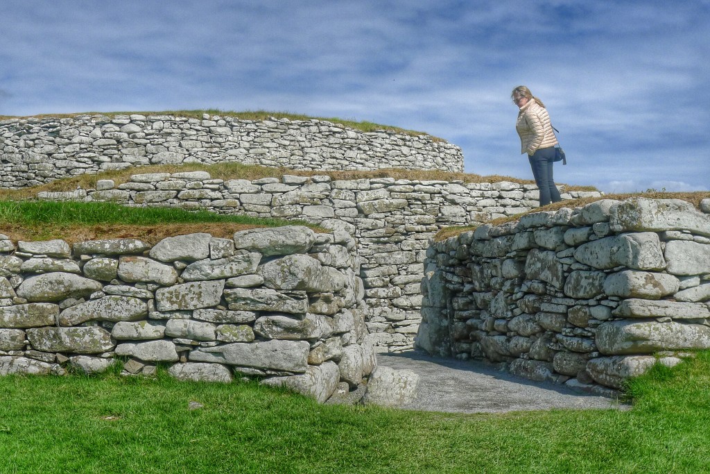A woman takes a gander at the impressive broch in Lerwick.
