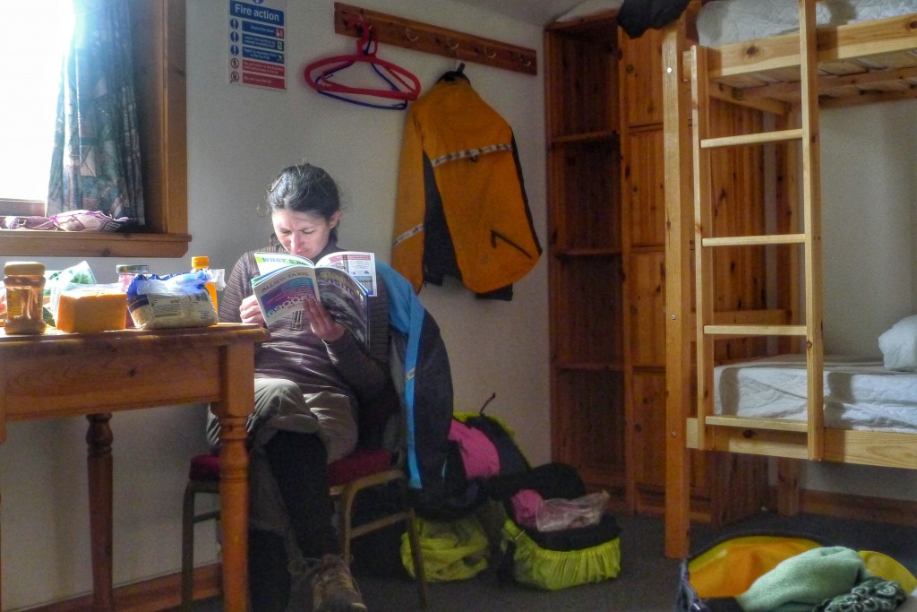 Carrie does some reading in the hostel in Lerwick. It felt so luxurious to be indoors.